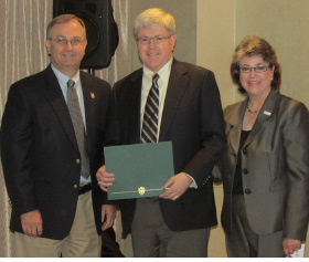 ASCO honored Dr. Kevin Alexander (center) with a resolution during its annual meeting in June. Pictured with him are Dr. Larry J. Davis (left) and Dr. Linda Casser.