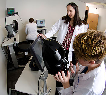 Assistant Professor Dr. Heather Anderson supervises Kristen Bowles as she examines a virtual patient.