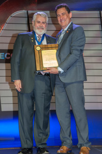 Dr. Richard Phillips accepts the Optometrist of the South award from outgoing SECO President Dr. Jim Herman.